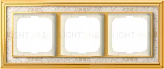 Рамка ABB Dynasty трехместная (латунь полированная, белая роспись) 2CKA001754A4572 2CKA001754A4572